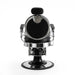 Rear view of professional black barber chair with headrest