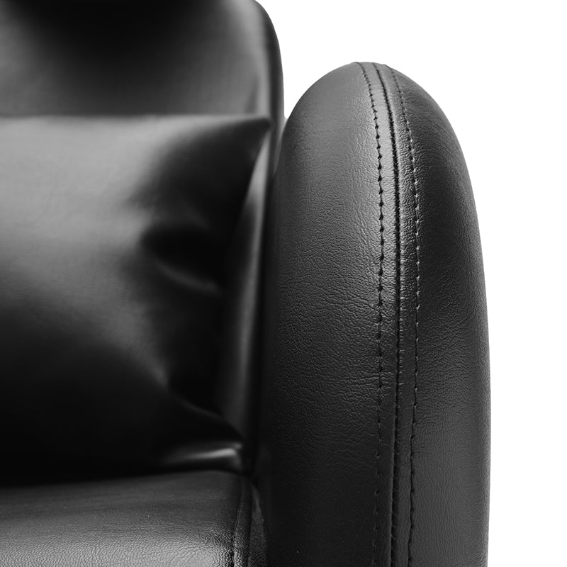 Close-up detail of black vinyl upholstery on Violeta shampoo unit
